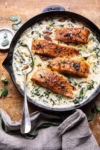 Creamy Spinach and Artichoke Salmon | halfbakedharvest.com #salmon #garlicbutter #easyrecipes