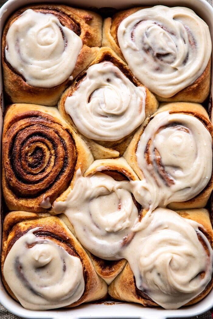 Easy Gingerbread Brioche Cinnamon Rolls | halfbakedharvest.com #cinnamonrolls #gingerbread overhead close up photo of Easy Gingerbread Brioche Cinnamon Rolls in baking dish