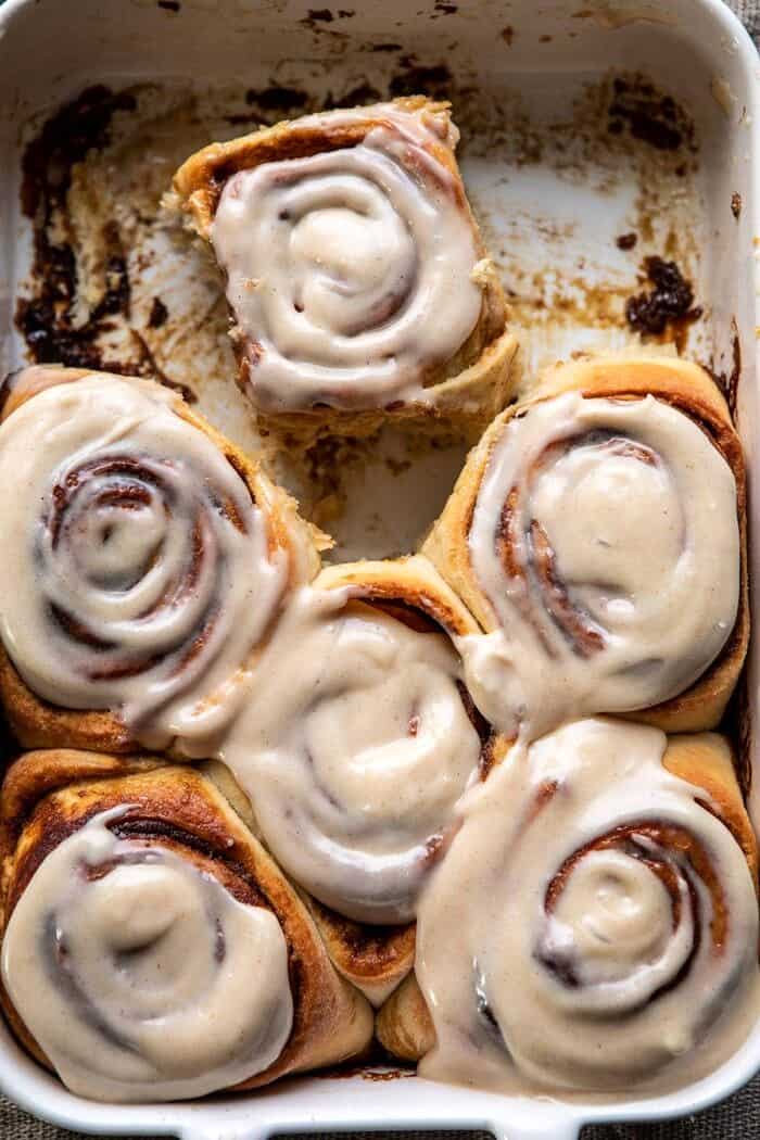 Easy Gingerbread Brioche Cinnamon Rolls | halfbakedharvest.com #cinnamonrolls #gingerbread overhead close up photo of Easy Gingerbread Brioche Cinnamon Rolls in baking pan