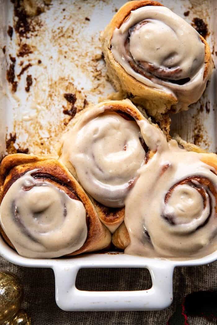 Easy Gingerbread Brioche Cinnamon Rolls | halfbakedharvest.com #cinnamonrolls #gingerbread overhead close up photo of Easy Gingerbread Brioche Cinnamon Rolls in pan