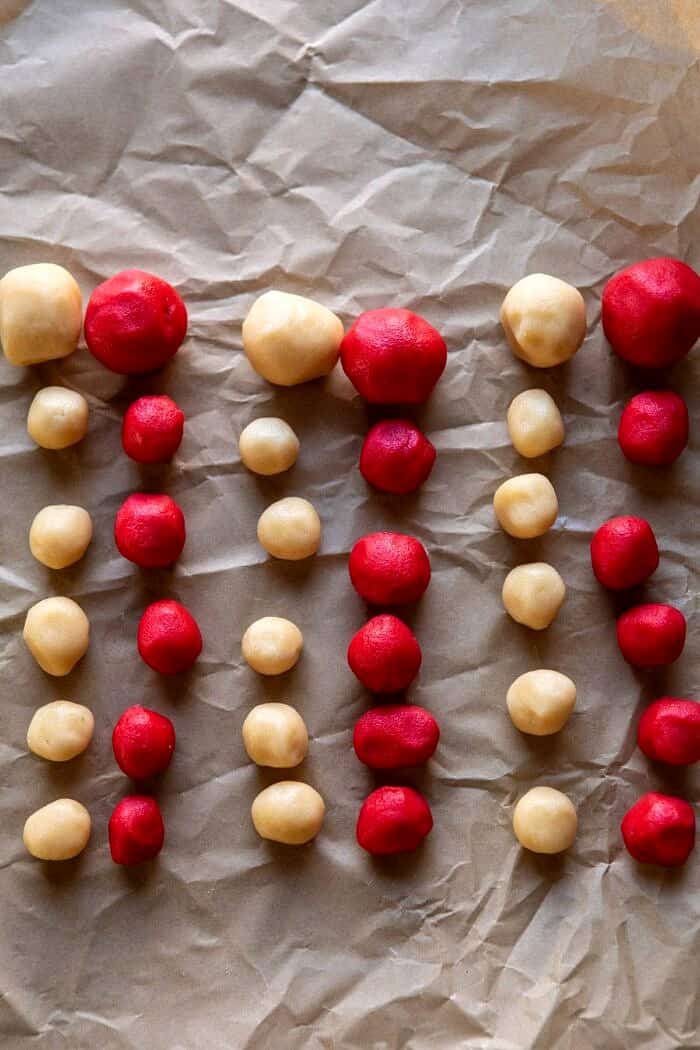 Holly Jolly Santa Cookies | halfbakedharvest.com #santacookies #sugarcookies dough balls lined up before assembling