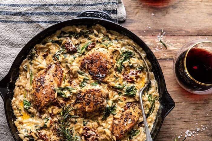 One Skillet Creamy Sun-Dried Tomato Chicken and Orzo | halfbakedharvest.com #skilletdinner #chicken #orzo horizontal photo of One Skillet Creamy Sun-Dried Tomato Chicken and Orzo