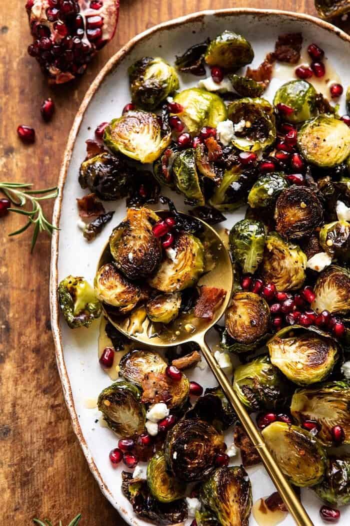 overhead close up photo of Roasted Bacon Brussels Sprouts with Salted Honey with spoon on plate