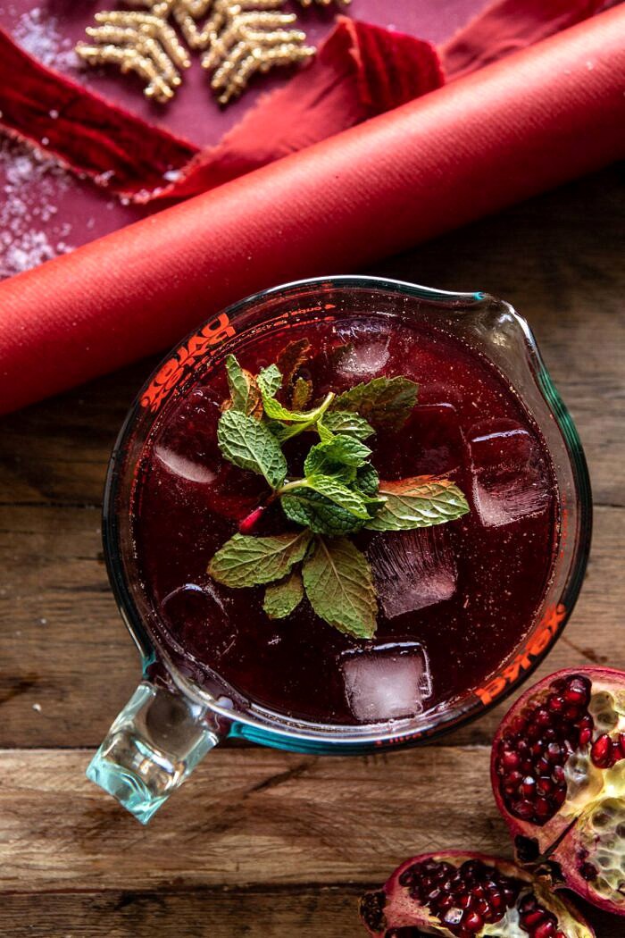 The Santa Clause Smash | halfbakedharvest.com #christmasdrink #bourbon #cocktail overhead photo of The Santa Clause Smash in measuring cup