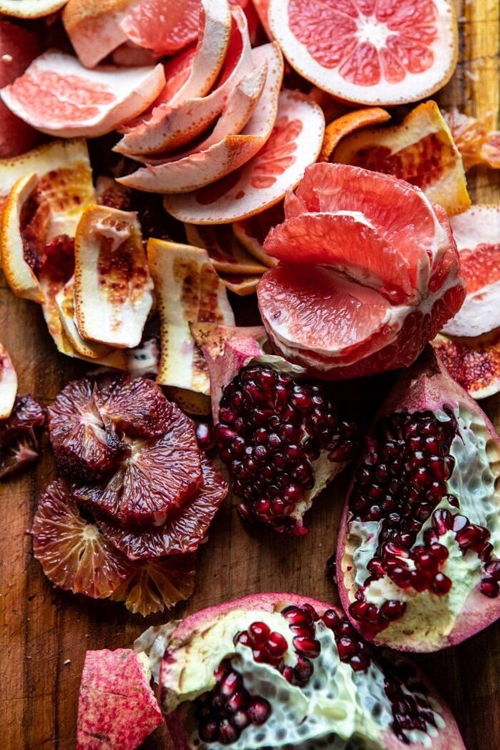 Winter Pomegranate Salad with Maple Candied Walnuts | halfbakedharvest.com #wontersalad #healthy pomegranates and citrus on cutting board