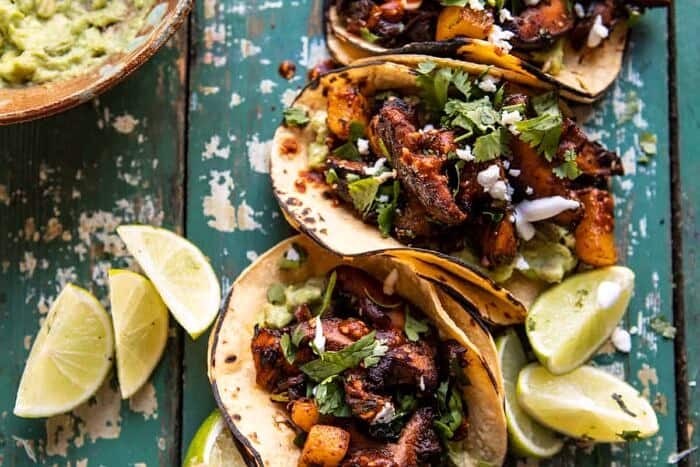 Mushroom Al Pastor Tacos with Garlic Lime Special Sauce | halfbakedharvest.com #vegan #mushrooms #tacos horizontal photo of Mushroom Al Pastor Tacos with Garlic Lime Special Sauce