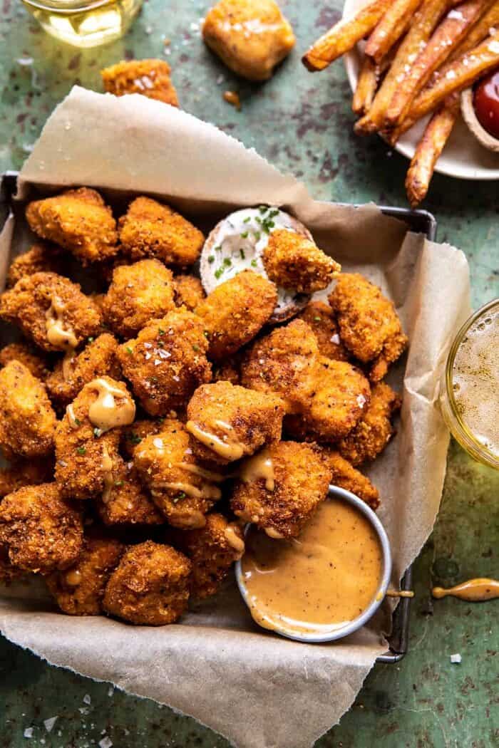 Oven Fried Cajun Popcorn Chicken with Creamy Honey Mustard | halfbakedharvest.com #chickenfingers #easyrecipes overhead photo of Oven Fried Cajun Popcorn Chicken with Creamy Honey Mustard