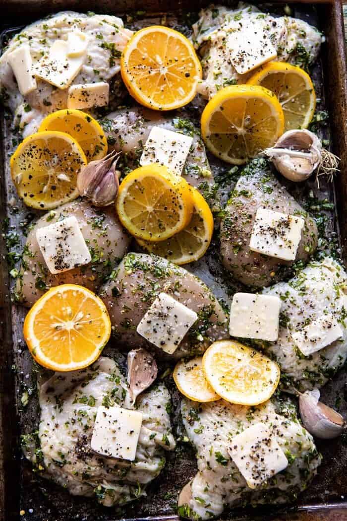 overhead photo of Roasted Garlic Butter Chicken on sheet pan before roasting