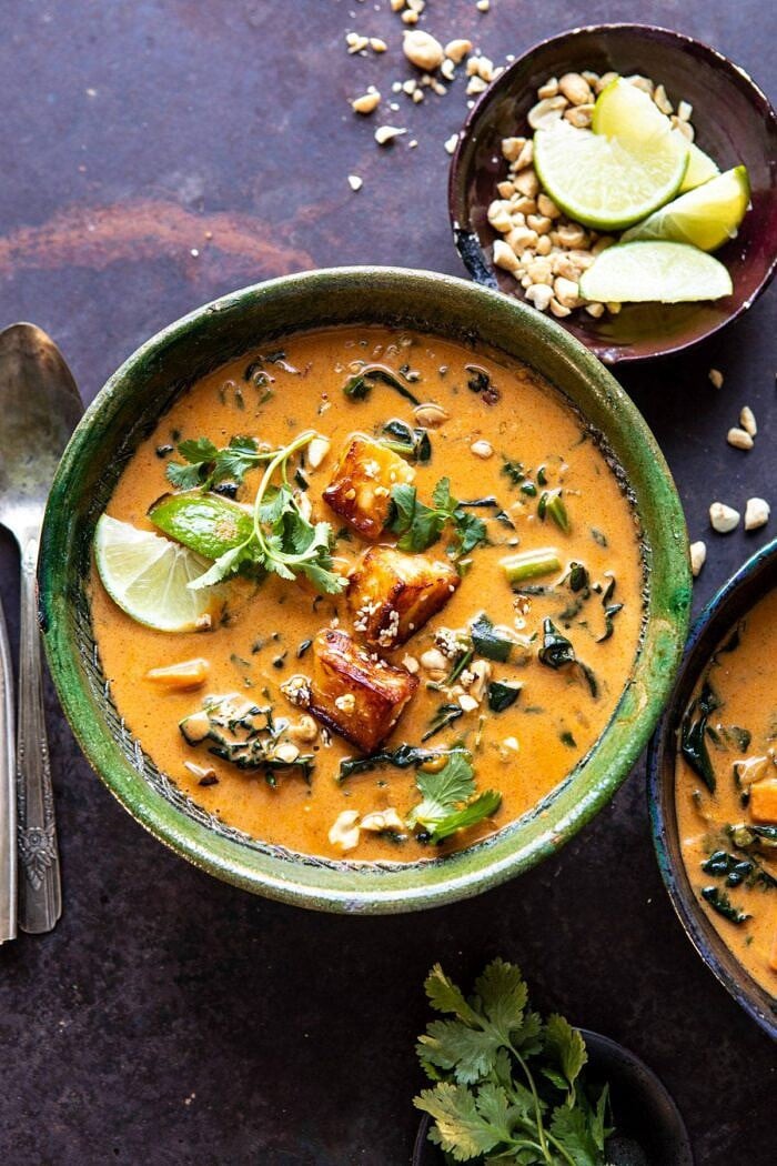 overhead photo of Spicy Peanut Soup with Sesame Halloumi | halfbakedharvest.com #peanutsoup #healthy #thai