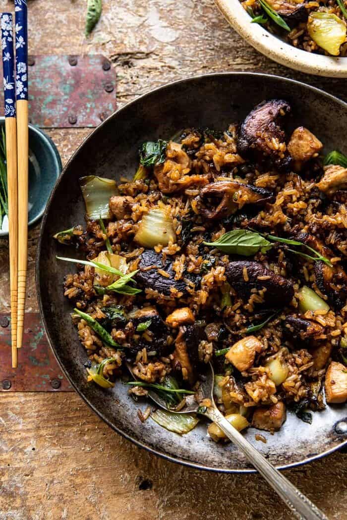 overhead photo of Better Than Takeout Sesame Ginger Chicken Fried Rice with serving spoon in skillet