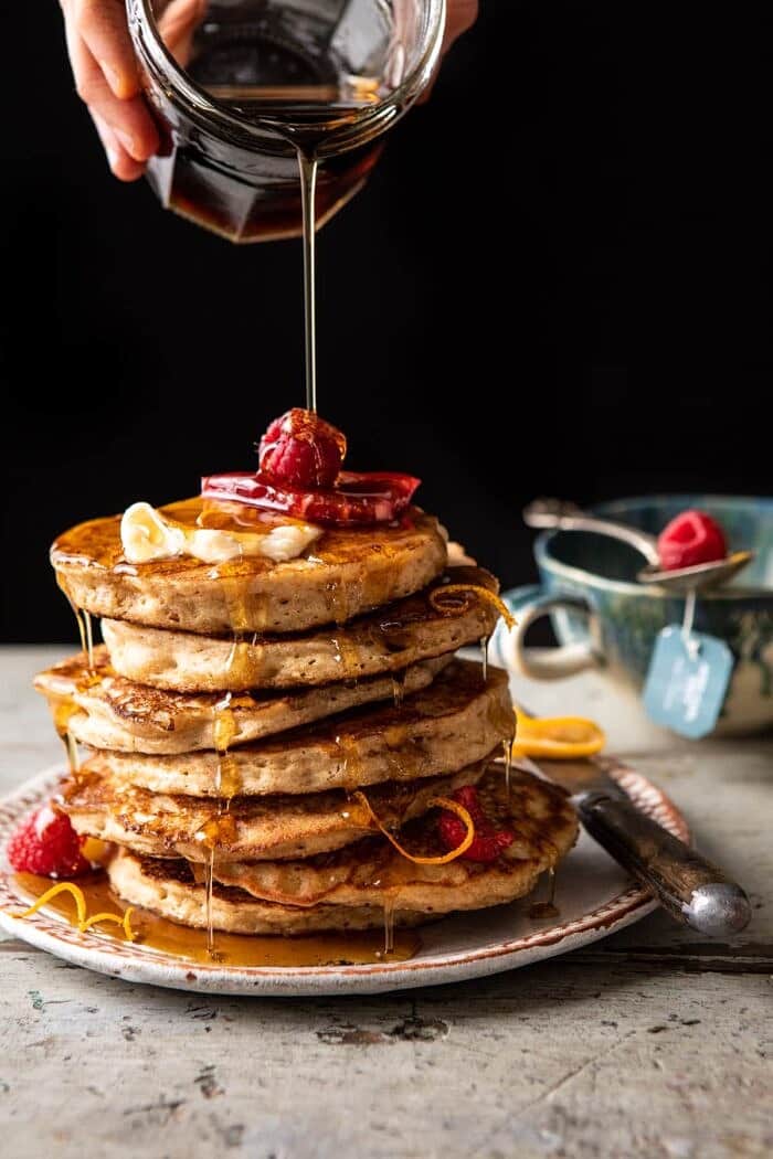 Earl Grey Lemon Ricotta Pancakes with Salted Maple Butter | halfbakedharvest.com Earl Grey Lemon Ricotta Pancakes with Salted Maple Butter and maple syrup being poured over pancakes