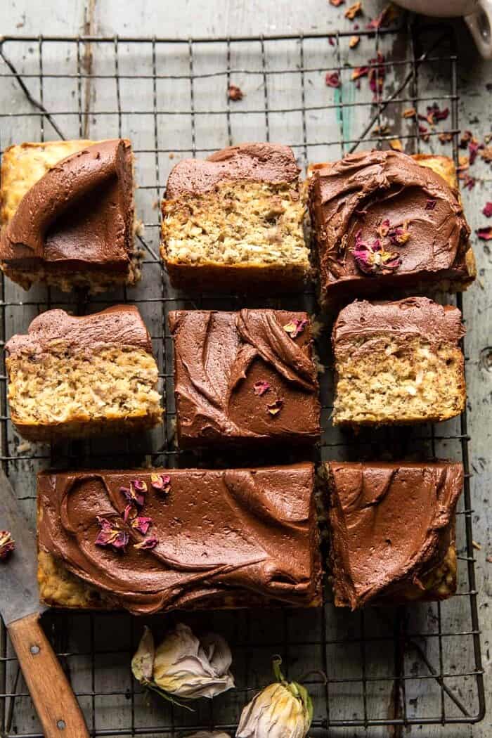 overhead photo of Easiest Coconut Banana Cake with Fudgy Chocolate Frosting with 9 pieces of cake cut into squares