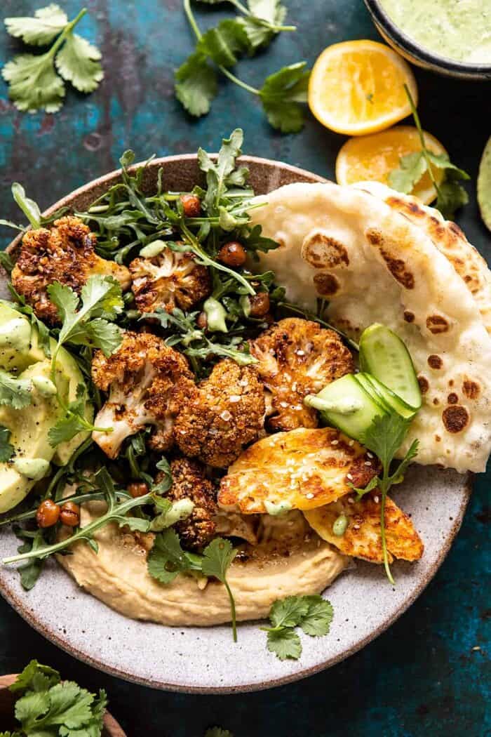 Cauliflower Shawarma with Green Tahini and Fried Halloumi | halfbakedharvest.com overhead close up photo of Cauliflower Shawarma with Green Tahini and Fried Halloumi