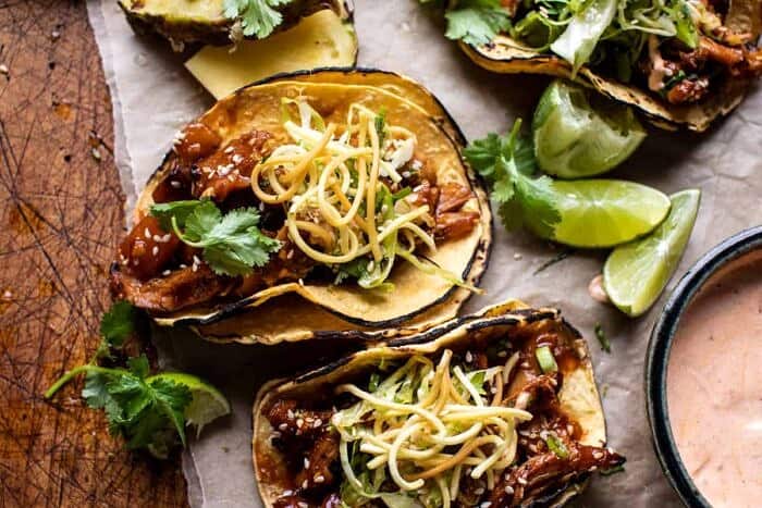 overhead horizontal photo of Slow Cooker Braised Hawaiian Pineapple Chicken Tacos