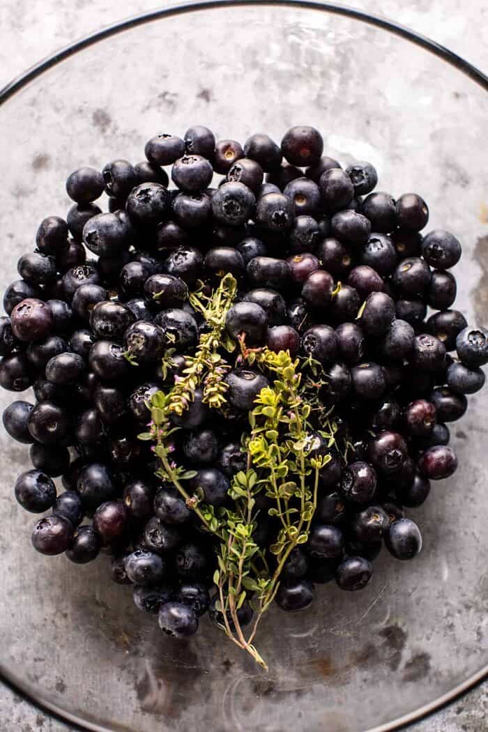 Bursting Blueberry Lemon Thyme Tarts | halfbakedharvest.com overhead prep photo of blueberries in bowl