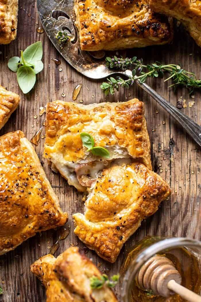 Prosciutto Caprese Puff Pastries with Peppery Thyme Honey | halfbakedharvest.com overhead close up photo of Prosciutto Caprese Puff Pastries with Peppery Thyme Honey