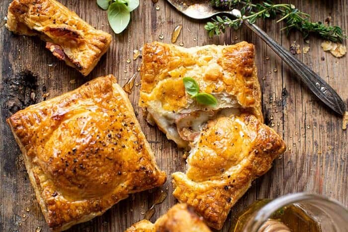 Prosciutto Caprese Puff Pastries with Peppery Thyme Honey | halfbakedharvest.com overhead horizontal photo of Prosciutto Caprese Puff Pastries with Peppery Thyme Honey