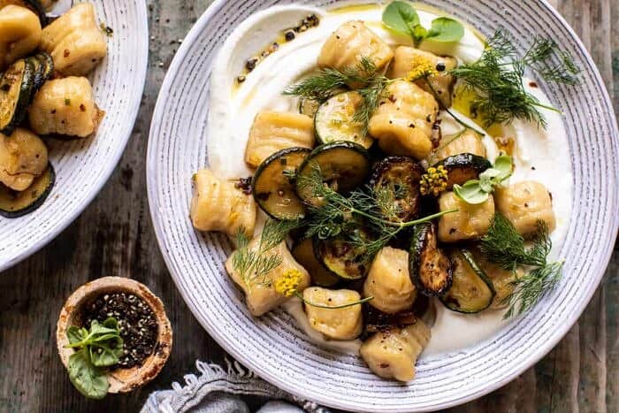 Cauliflower Gnocchi with Crispy Zucchini and Whipped Goat Cheese | halfbakedharvest.com overhead horizontal photo of Cauliflower Gnocchi with Crispy Zucchini and Whipped Goat Cheese