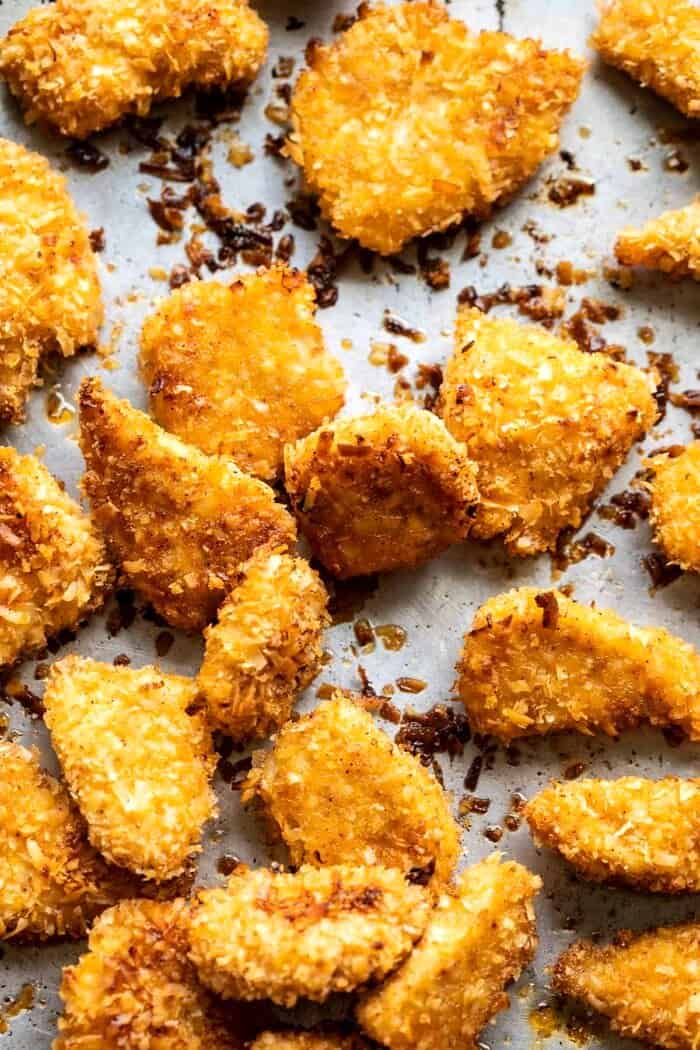 overhead prep photo of Coconut Popcorn Chicken on baking sheet 