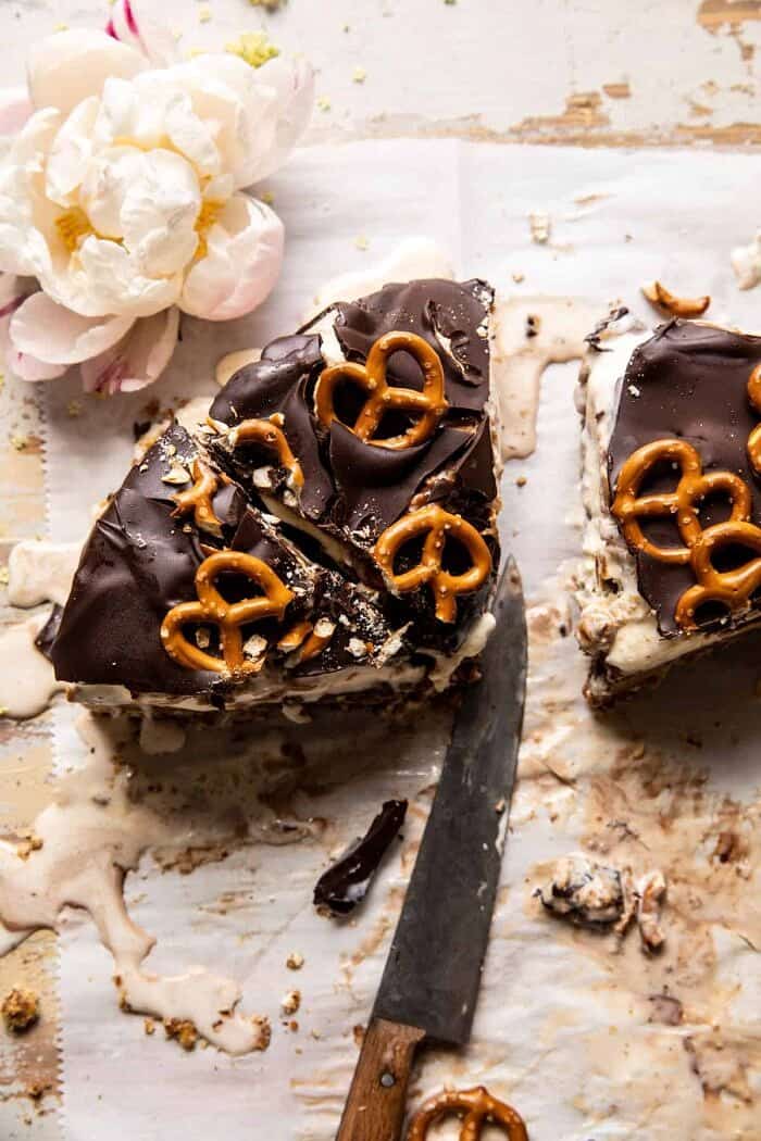 Fudgy Chocolate Peanut Butter Ice Cream Pretzel Cake | halfbakedharvest.com overhead photo of Fudgy Chocolate Peanut Butter Ice Cream Pretzel Cake slices