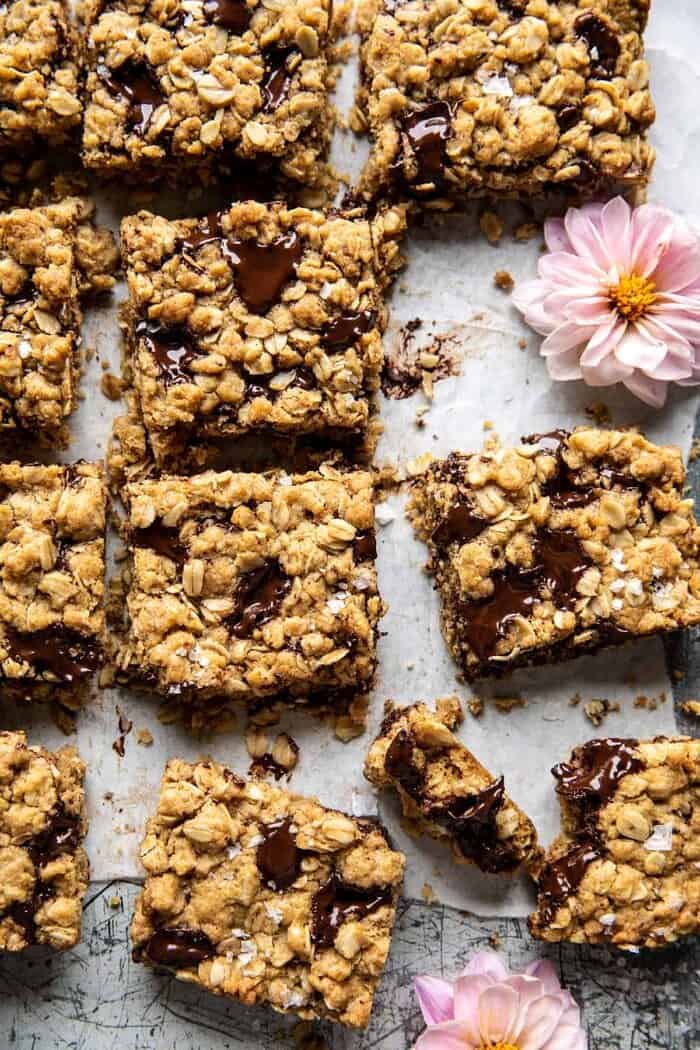 Healthier Dark Chocolate Chunk Oatmeal Cookie Bars | halfbakedharvest.com overhead close up photo of Healthier Dark Chocolate Chunk Oatmeal Cookie Bars