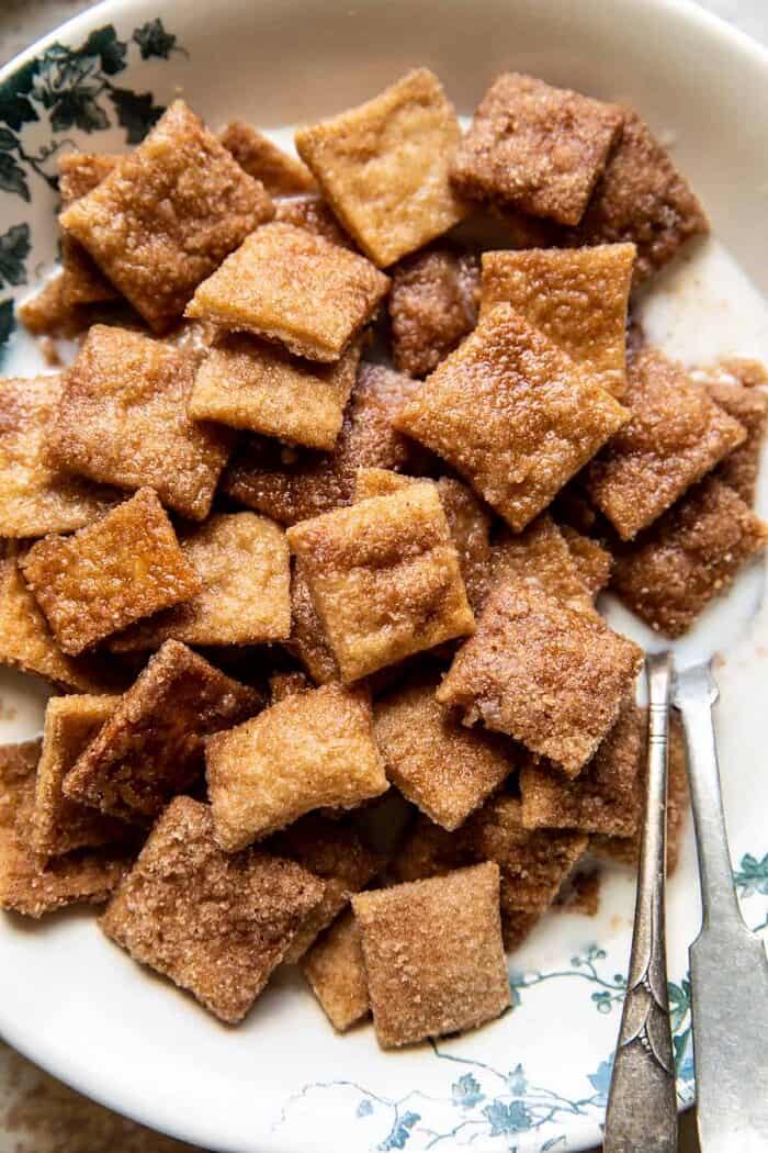 Homemade Cinnamon Toast Crunch | halfbakedharvest.com overhead close up photo of Homemade Cinnamon Toast Crunch in bowl with milk
