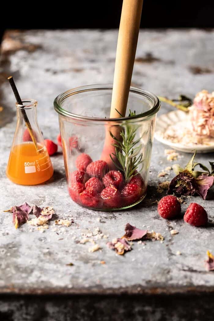 The Hermione Granger Cocktail | halfbakedharvest.com prep photo of The Hermione Granger Cocktail being muddled together