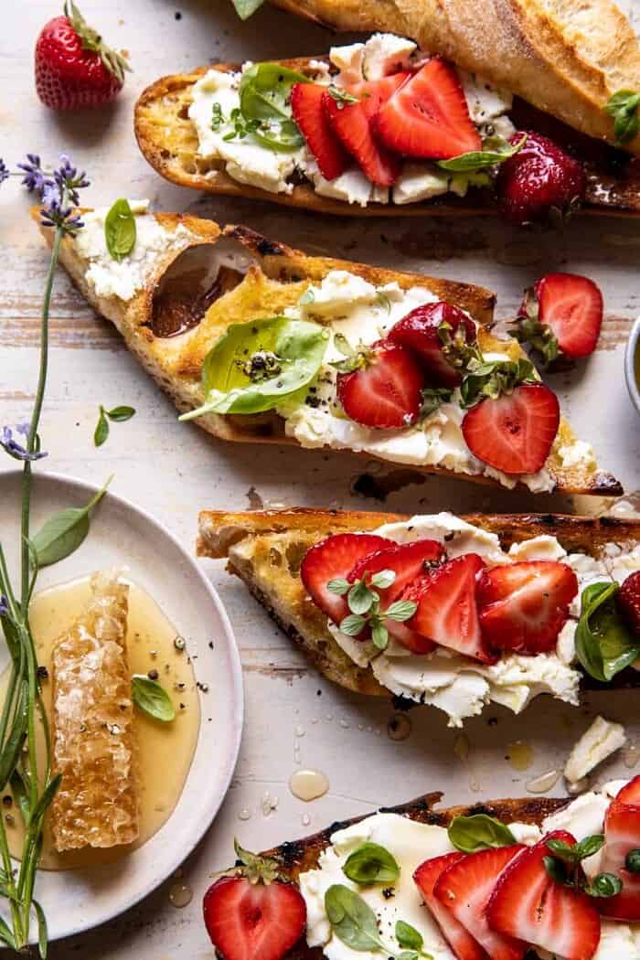 Marinated Goat Cheese Strawberry Crostini | halfbakedharvest.com overhead close up photo of Marinated Goat Cheese Strawberry Crostini
