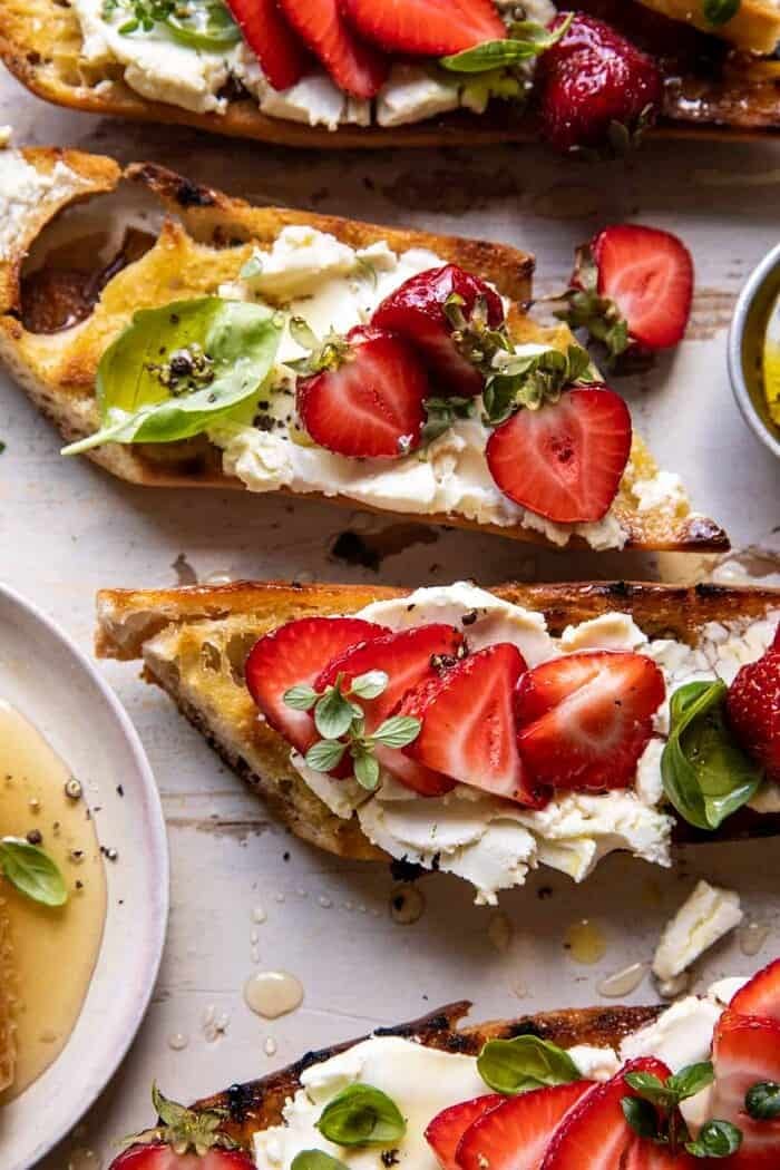 Marinated Goat Cheese Strawberry Crostini | halfbakedharvest.com overhead close up photo of Marinated Goat Cheese Strawberry Crostini