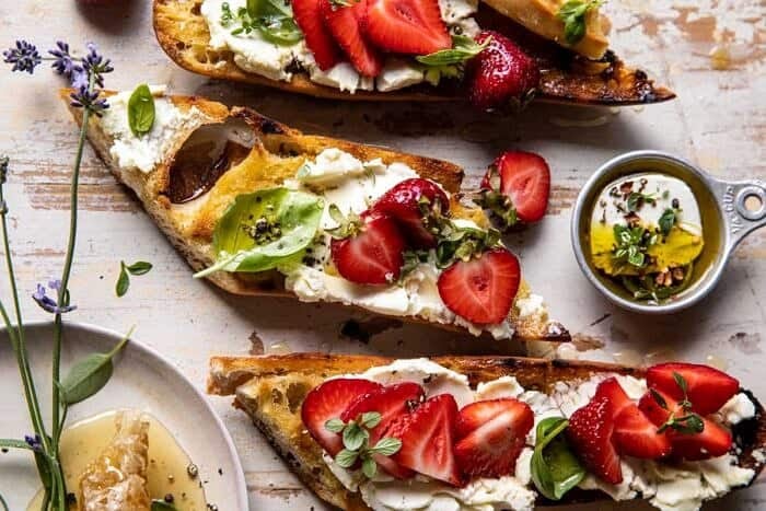 Marinated Goat Cheese Strawberry Crostini | halfbakedharvest.com overhead horizontal photo of Marinated Goat Cheese Strawberry Crostini