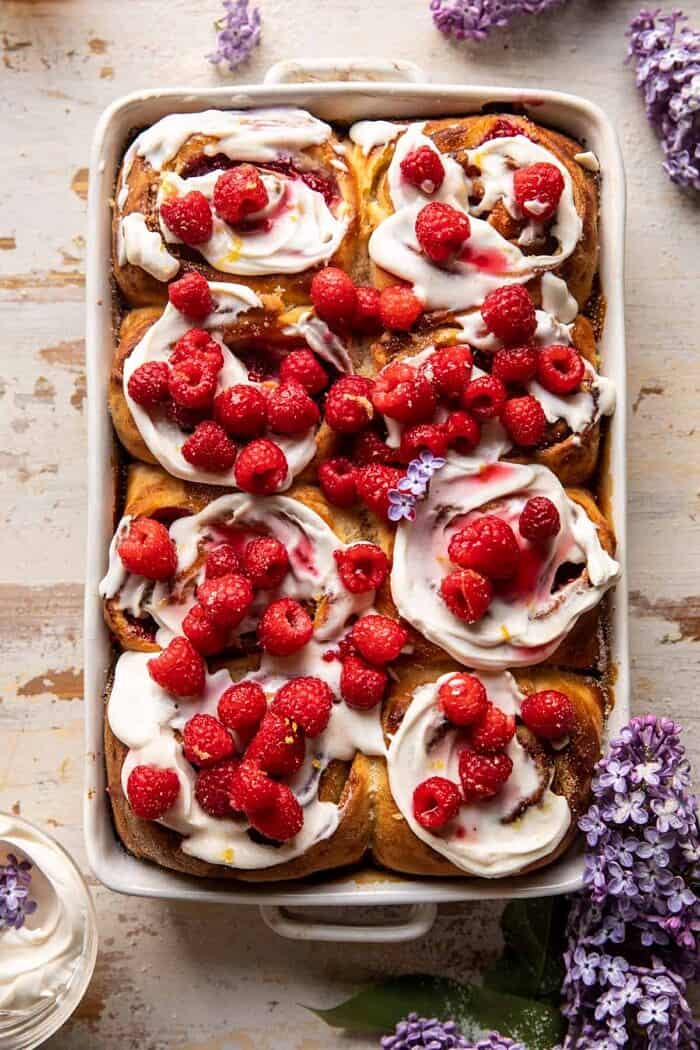 overhead photo of Raspberry Lemon Brioche Rolls with Whipped Ricotta Cream in baking pan