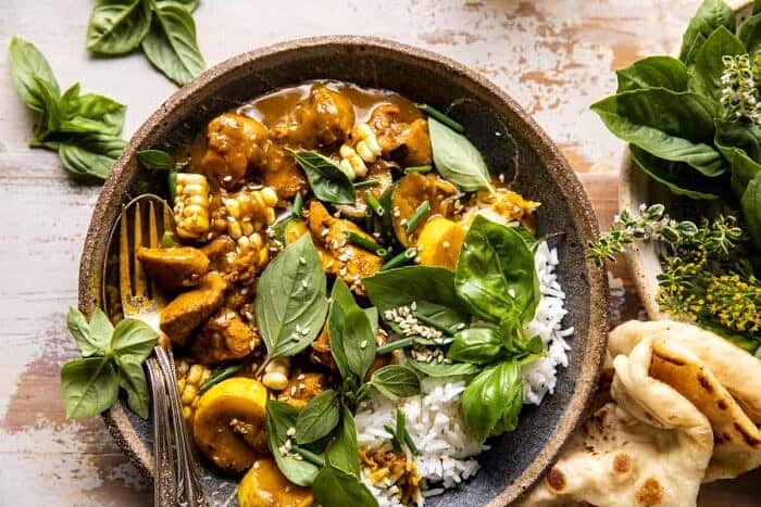 overhead horizontal photo of Spicy Coconut Basil Chicken Curry with Garden Vegetables 