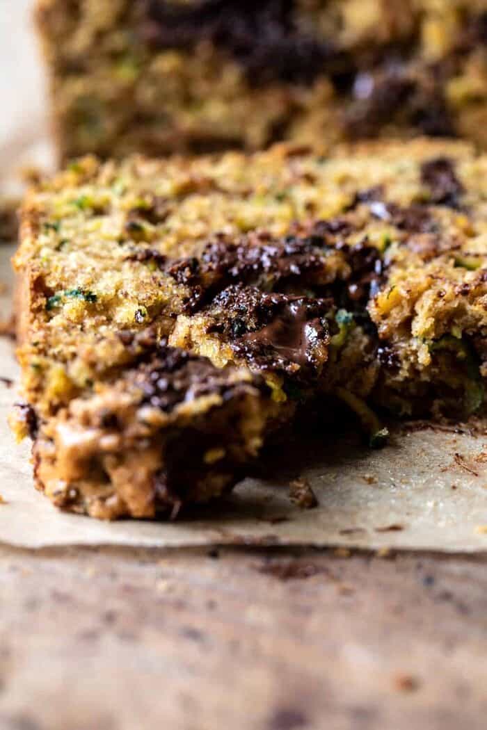 Chocolate Chunk Almond Butter Zucchini Bread | halfbakedharvest.com slide angle close up photo of Chocolate Chunk Almond Butter Zucchini Bread