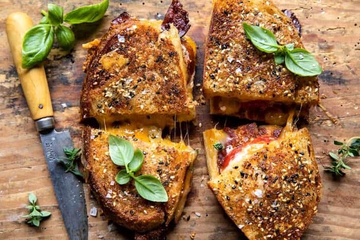 overhead horizontal photo of Everything Cheddar Tomato Bacon Grilled Cheese