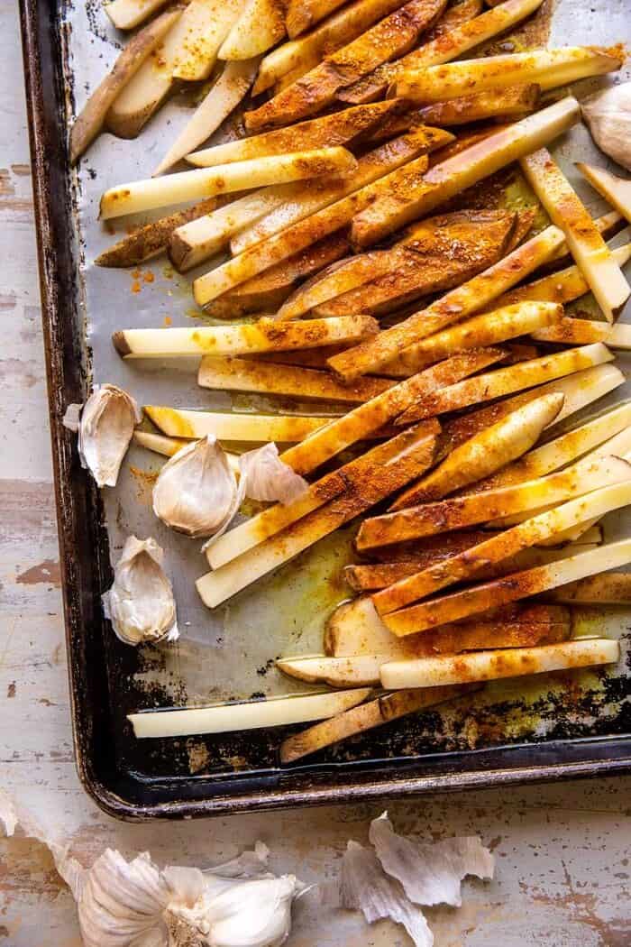 Grilled Chicken Shawarma with Golden Butter Fries and Garlic Sauce | halfbakedharvest.com overhead prep photo of Golden Butter Fries before baking