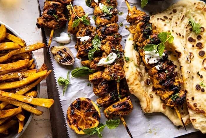 Grilled Chicken Shawarma with Golden Butter Fries and Garlic Sauce | halfbakedharvest.com overhead horizontal photo of Grilled Chicken Shawarma with Golden Butter Fries and Garlic Sauce