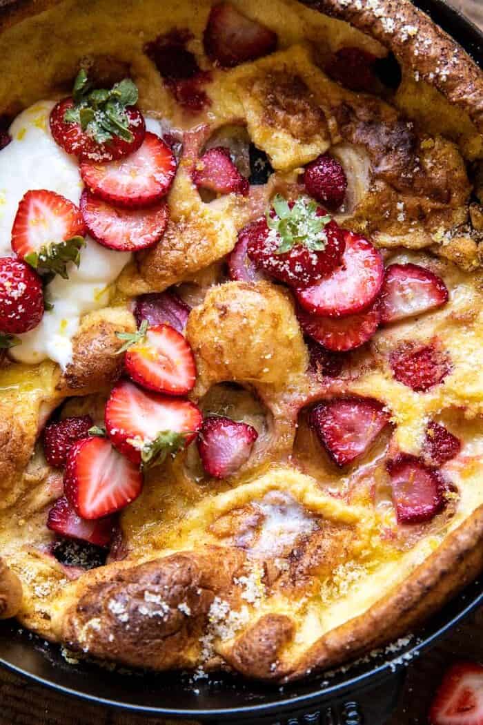 Lemon Strawberry Dutch Baby with Ricotta Cream | halfbakedharvest.com overhead close up photo of Lemon Strawberry Dutch Baby with Ricotta Cream