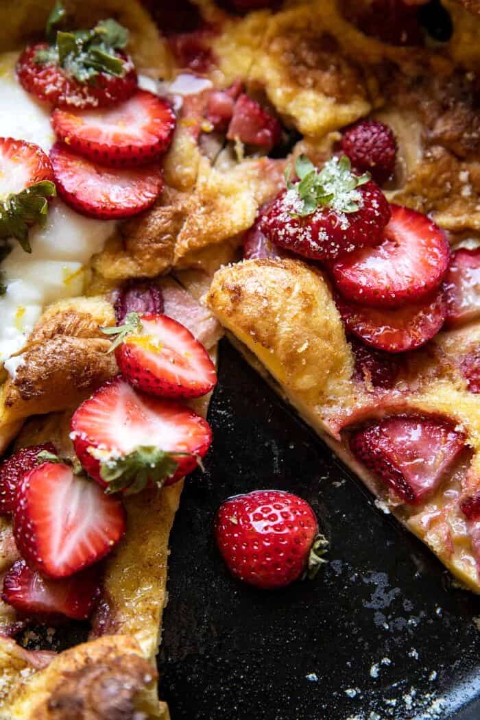 Lemon Strawberry Dutch Baby with Ricotta Cream | halfbakedharvest.com overhead close up photo of Lemon Strawberry Dutch Baby with Ricotta Cream