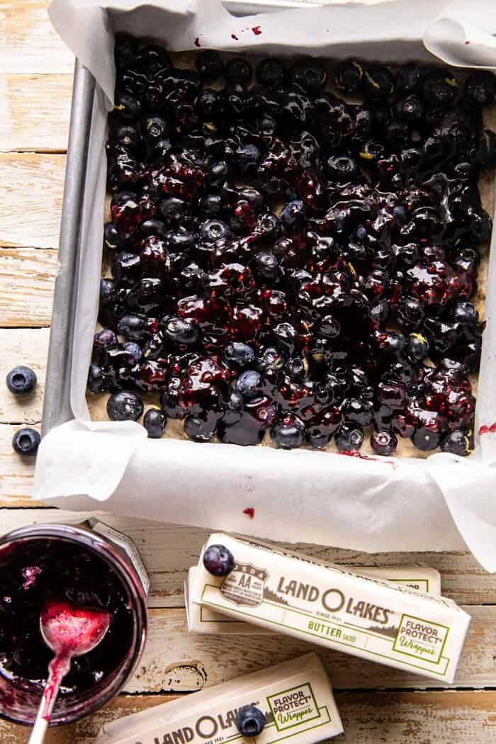 Cinnamon Sugar Blueberry Crumb Bars | halfbakedbarvest.com overhead prep photo of Cinnamon Sugar Blueberry Crumb Bars before baking