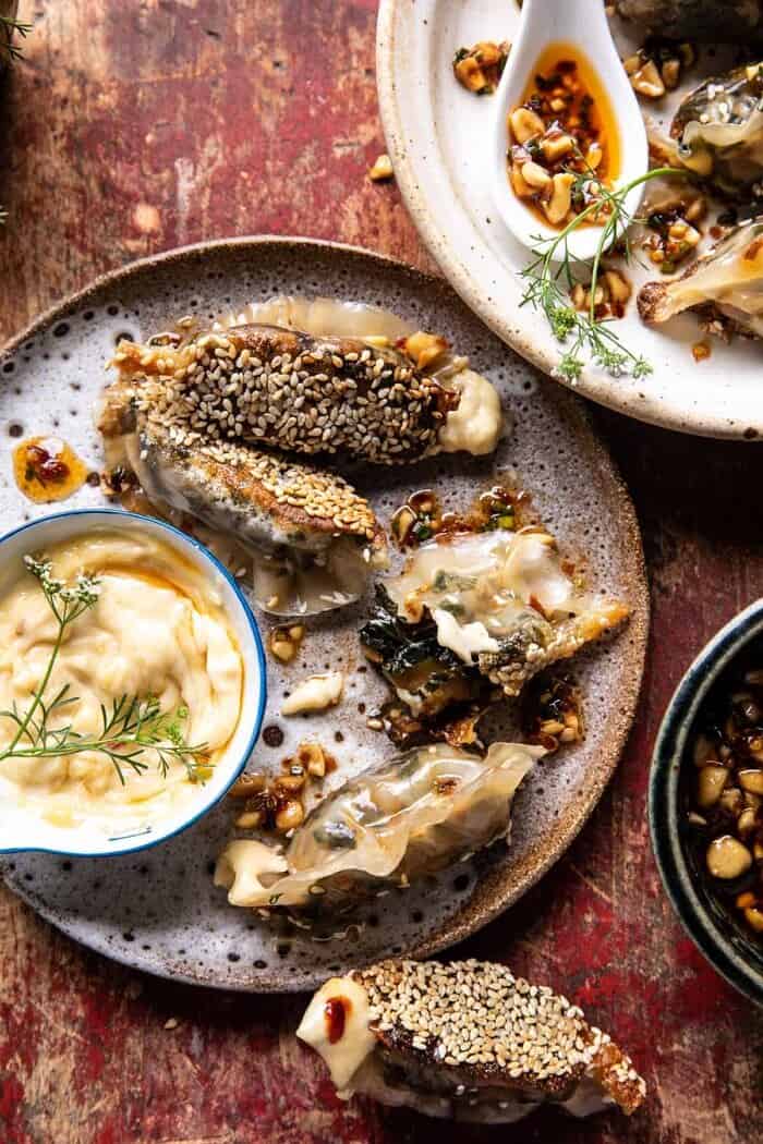 Crispy Sesame Ginger Potstickers with Chive Chili Sauce | halfbakedharvest.com overhead photo of Crispy Sesame Ginger Potstickers with Chive Chili Sauce