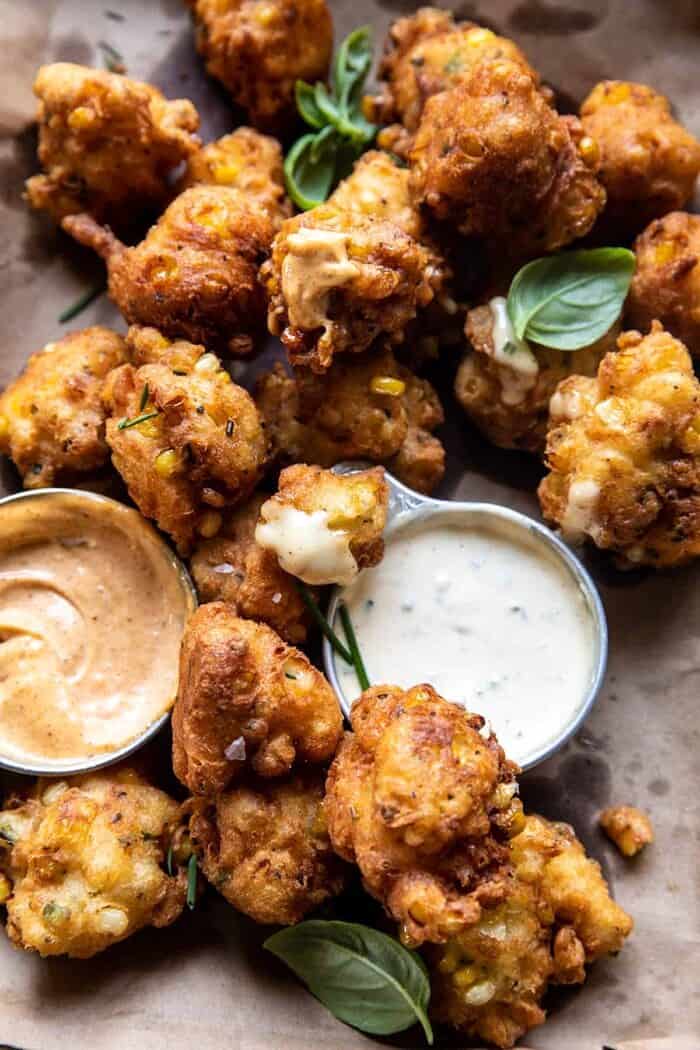 Jalapeño Cheddar Corn Fritters with Chipotle Aioli | halfbakedharvest.com side angled close up photo of Jalapeño Cheddar Corn Fritters with Chipotle Aioli
