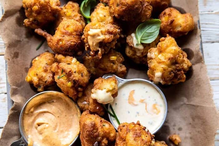 Jalapeño Cheddar Corn Fritters with Chipotle Aioli | halfbakedharvest.com overhead horizontal photo of Jalapeño Cheddar Corn Fritters with Chipotle Aioli