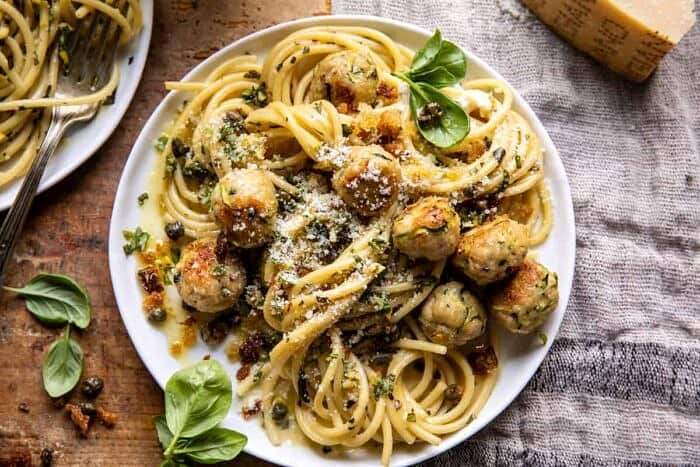 overhead horizontal photo of Zucchini Parmesan Chicken Meatballs with Lemon Pasta Carbonara 