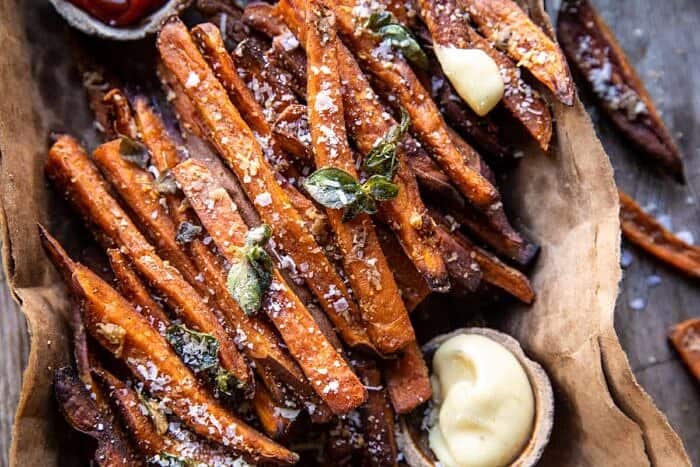 Garlic Parmesan Sweet Potato Fries with Spicy Aioli | halfbakedharvest.com overhead horizontal photo of Garlic Parmesan Sweet Potato Fries with Spicy Aioli