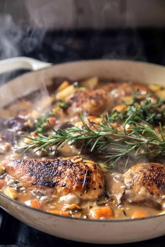 prep photo of chicken and rice cooking in skillet 