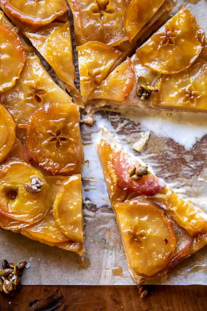 Salted Maple Apple Tarte Tatin with Cinnamon Pumpkin Seeds | halfbakedharvest.com overhead close up photo of Salted Maple Apple Tarte Tatin with Cinnamon Pumpkin Seeds