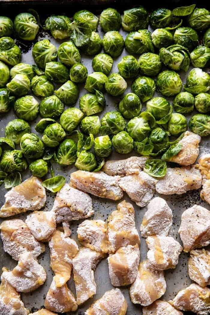 Sheet Pan Sticky Ginger Sesame Chicken and Crispy Brussels Sprouts | halfbakedharvest.com overhead prep photo of Sheet Pan Sticky Ginger Sesame Chicken and Crispy Brussels Sprouts before baking