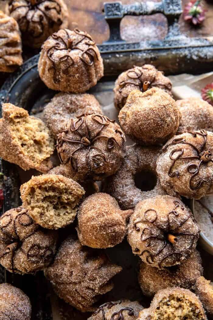 side angled photo of Mini Apple Cider Cakes broken in half to see the center