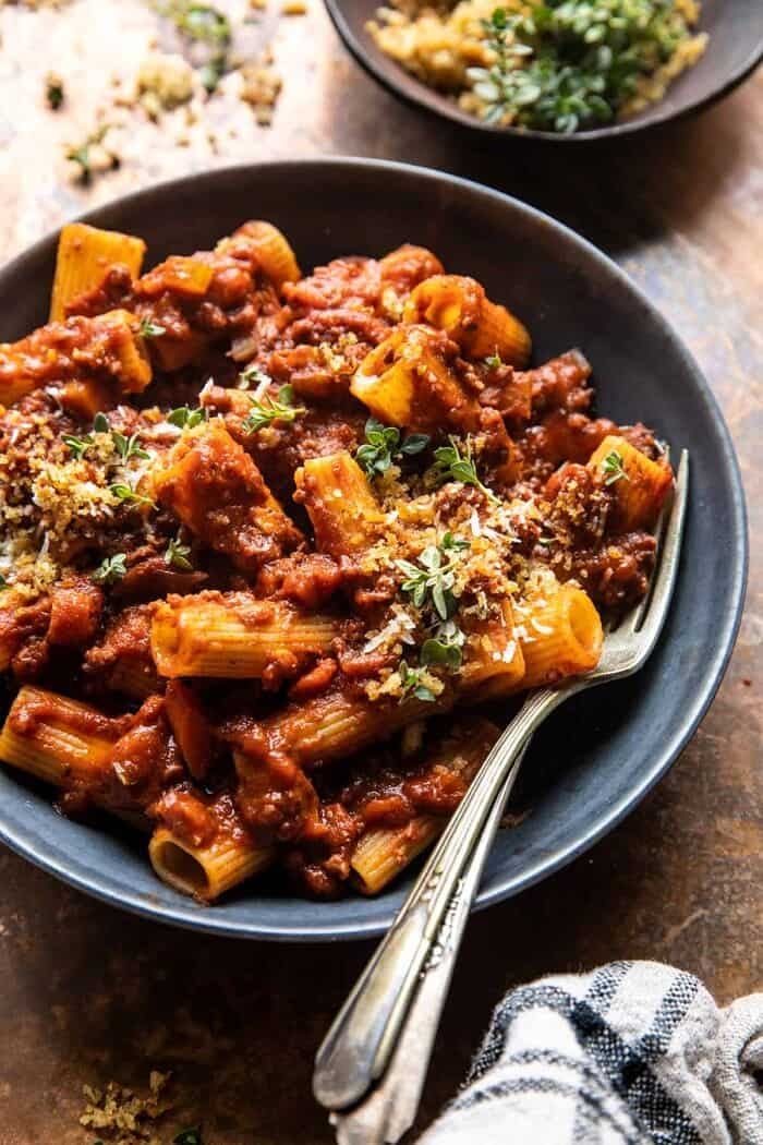 Slow Cooker Saucy Sunday Bolognese Pasta | halfbakedharvest.com side angled photo of Slow Cooker Saucy Sunday Bolognese Pasta