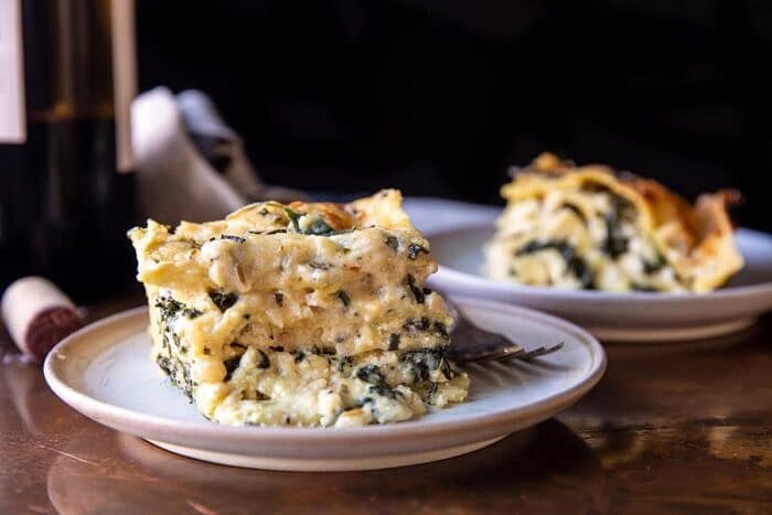 side angled horizontal photo of 4 Cheese Sage Pesto Florentine Lasagna